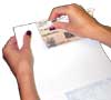 Tear printed checks at perforations